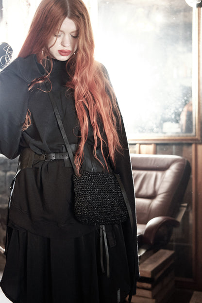 Knitted leather bag 275Y – worn held in hand